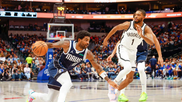 Dallas Mavericks superstar Kyrie Irving attacking the Brooklyn Nets' defense.